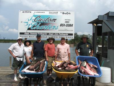 Daniel and gang show off their catch of mangrove snapper.